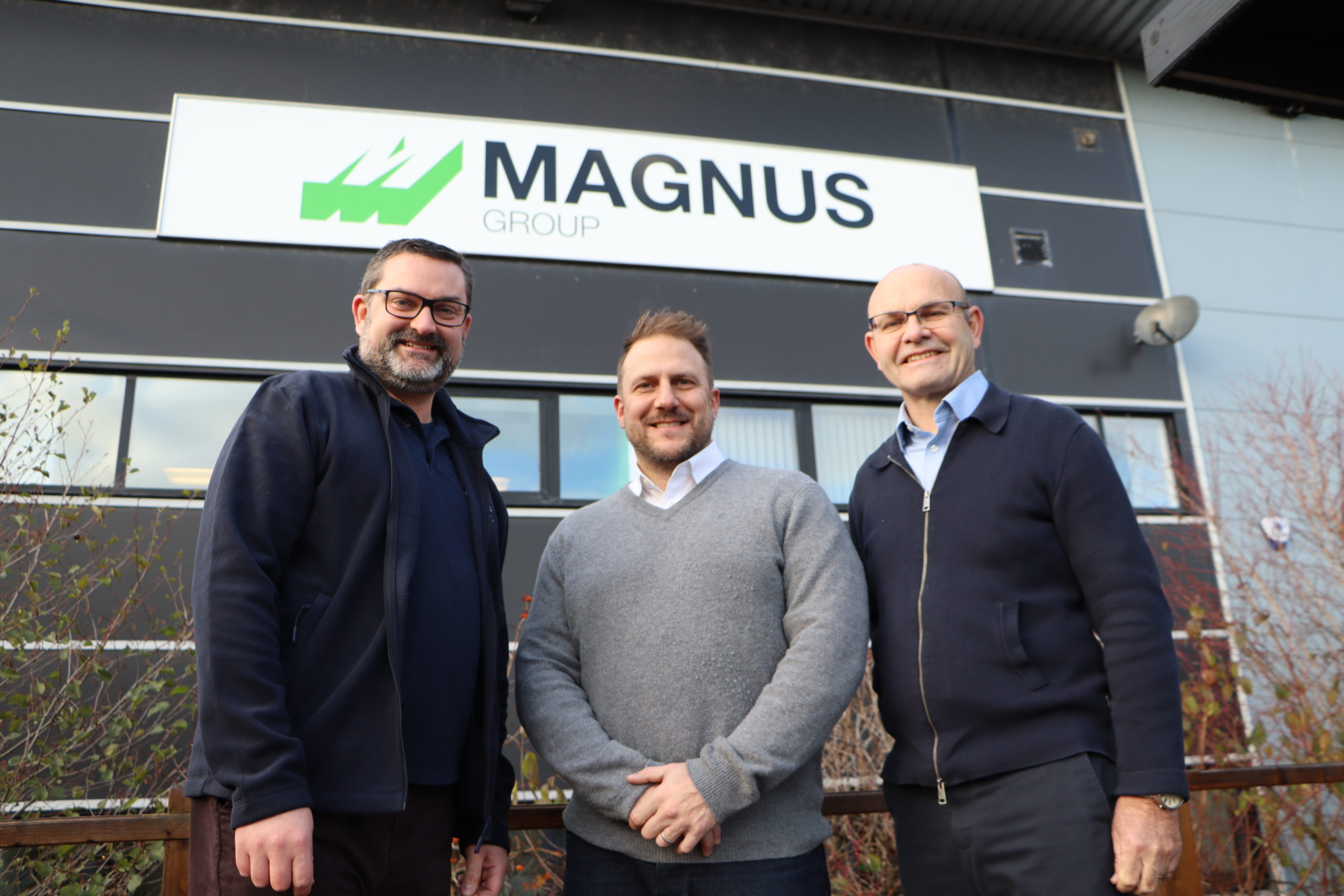 Jon Neal and Ian White of Suffolk Mind welcome new patron Olly Magnus outside Magnus group office